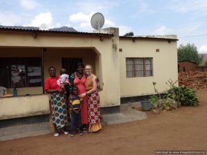 Claire with Jureka and host family